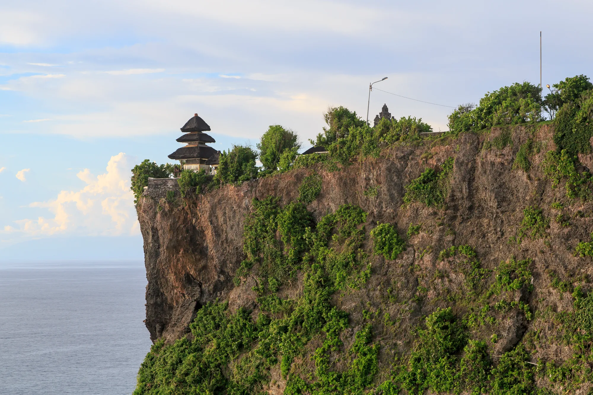 The meru of Pura Luhur Uluwatu on the edge of its cliff above the Indian Ocean